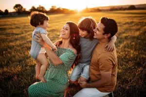 Parents playing with kids in nature