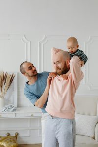 Happy family celebrating, showcasing a secure love style with their child