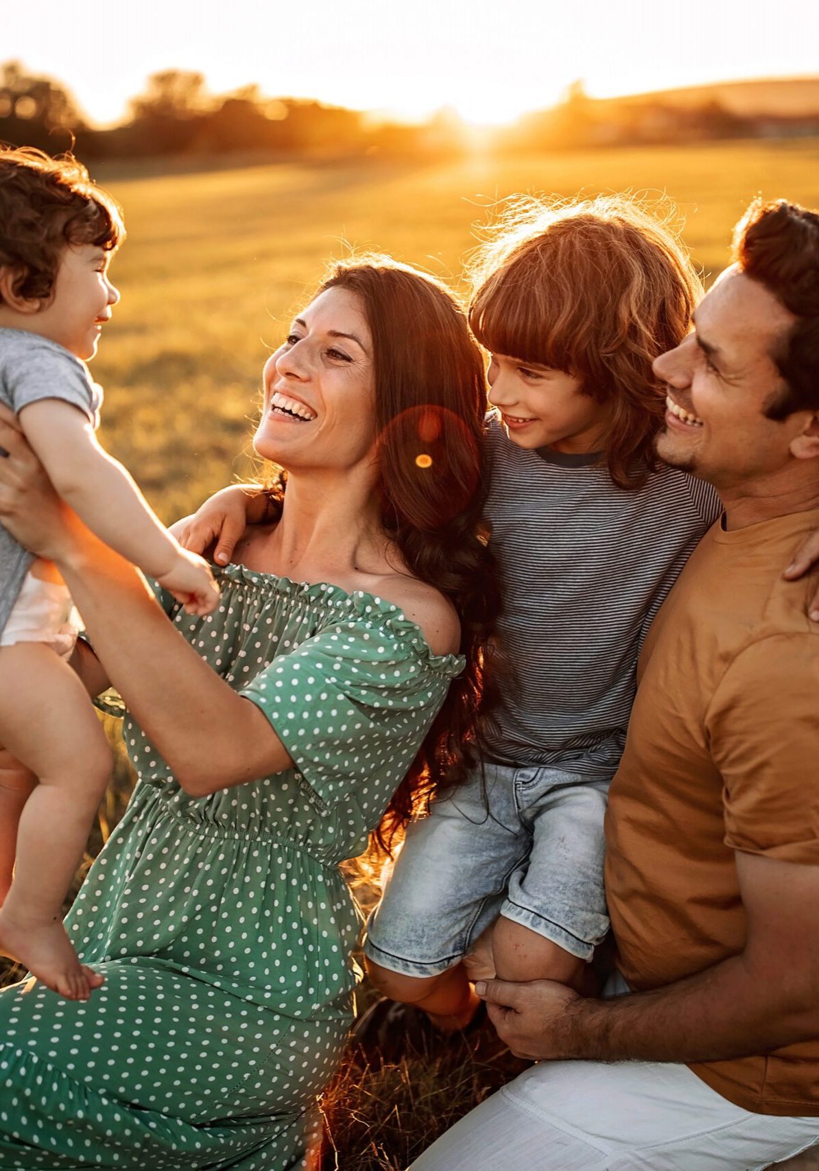 Parents playing with kids in nature